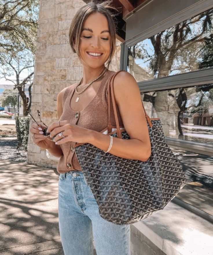 Woman carrying Élodie patterned tote bag outdoors with casual outfit