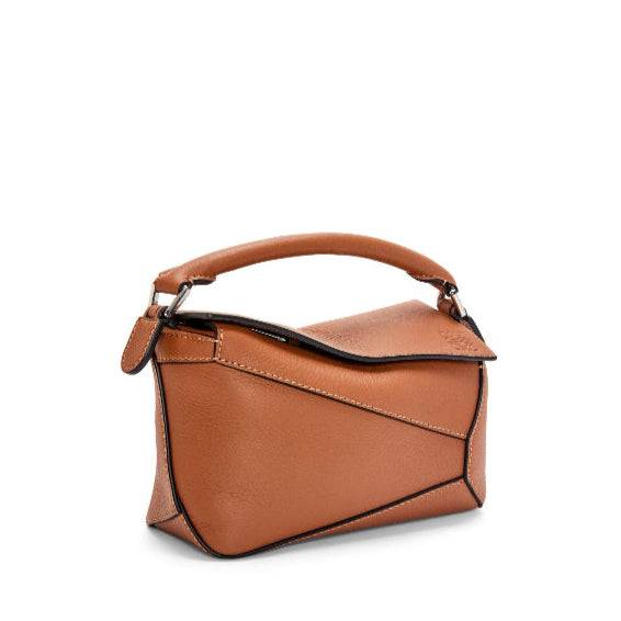 Leowyn Puzzle Handbag in brown premium leather with geometric design and structured silhouette
