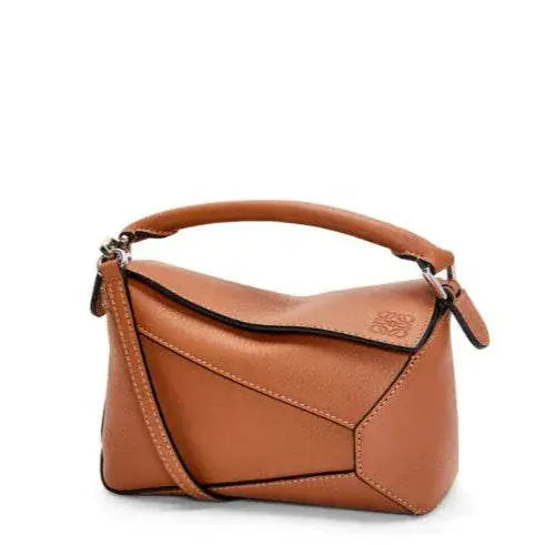 Leowyn Puzzle Handbag in brown leather with geometric design and top handle compact handbag
