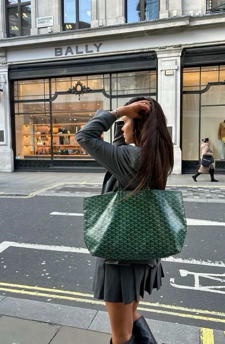 Élodie tote bag in signature patterned finish worn by woman on city street