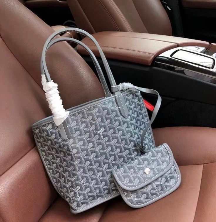 Élodie Mini Tote in subtle geometric pattern with double handles and detachable pouch on car seat